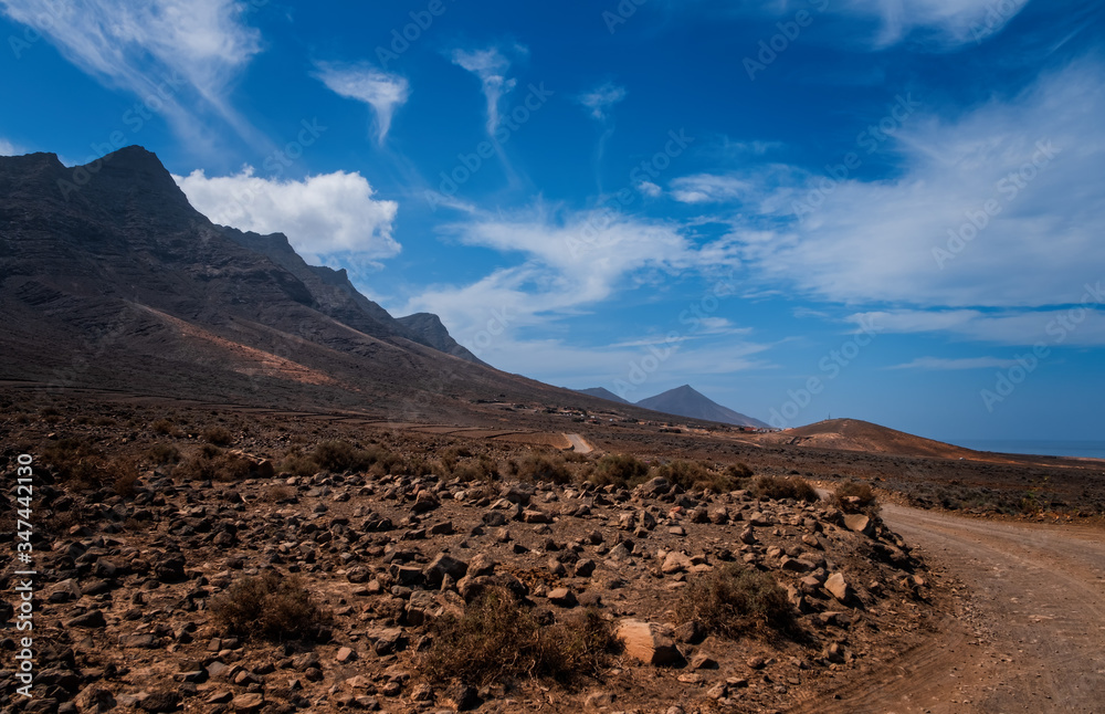 Scenic panorama with mountain range and Cofete beach (Playa de Cofete) at Fuerteventura, Canary Islands, Spain. October 2019