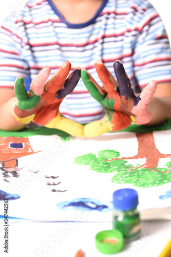 Young Indian Boy showing his painted hands