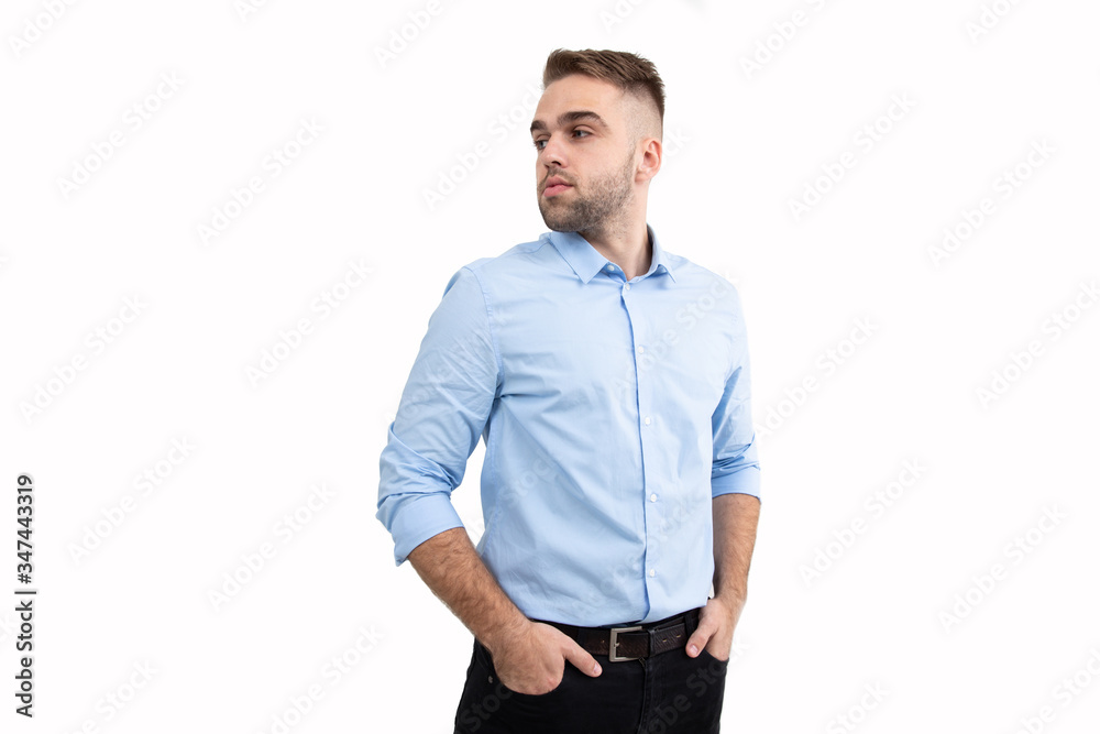 Portrait of a young man in a blue shirt on a white background Portrait of a young man in a blue shirt on a white background