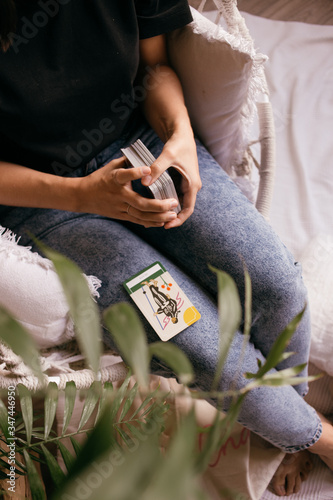 woman hands with tarot cards