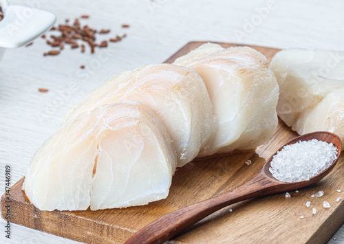 chopped cod on a wooden board
