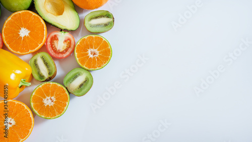 Fototapeta Naklejka Na Ścianę i Meble -  Banner from various vegetables and fruits isolated on white background, top view, creative flat layout. Concept of healthy eating, food background. Frame of vegetables with space for text.
