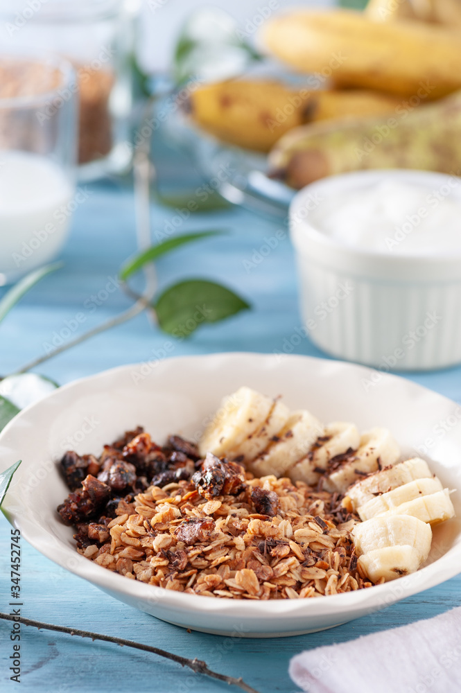 Healthy and delicious breakfast, granola with bananas and yogurt Healthy and delicious breakfast, granola with bananas and yogurt