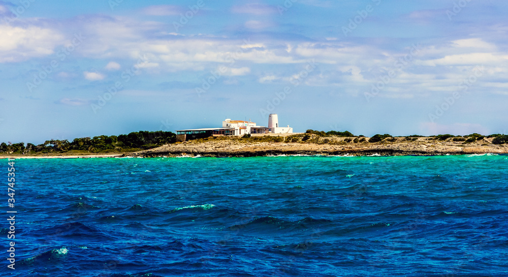 Formentera, Balearic Islands / Spain - April 7, 2012: Restaurant on the banks of the Mediterranean Sea seen from a boat / Es Moli de Sal