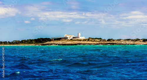 Formentera, Balearic Islands / Spain - April 7, 2012: Restaurant on the banks of the Mediterranean Sea seen from a boat / Es Moli de Sal