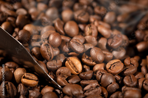 Coffee background. Roasted Coffee beans and scoop