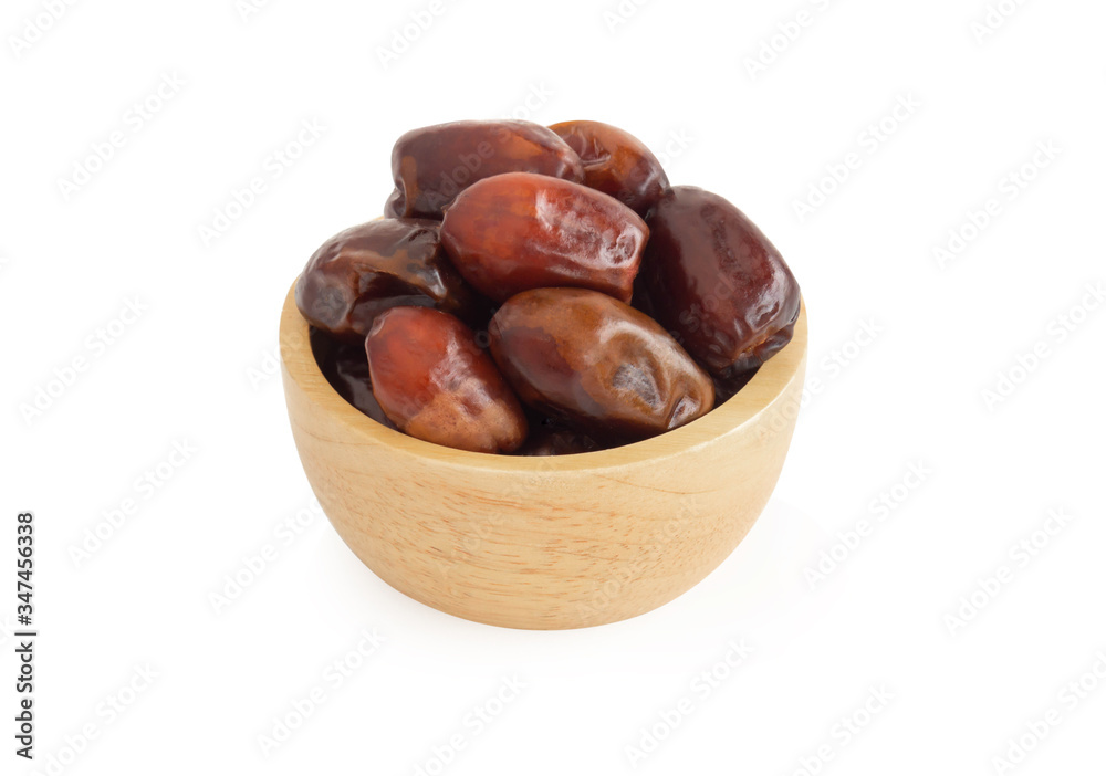 Date palm in wooden bowl isolated on white blackground, Food healthy concept Date palm in wooden bowl isolated on white blackground, Food healthy concept