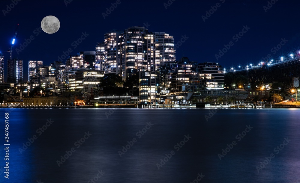 Sydney Harbour Bridge long night exposure showing the vibrant colours of the lights on the water