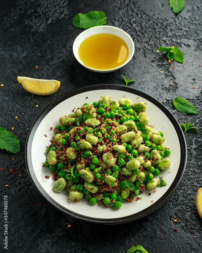 Vegan Green broad beans and quinoa salad with sweet peas and mint. Healthy food.