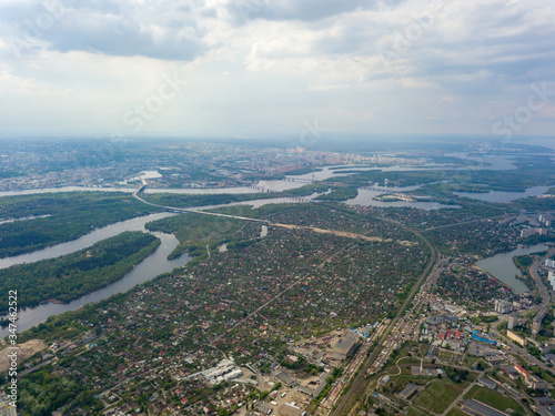 Spring rain over Kiev. There are black thunderclouds in the sky, dark rain falls on the city. Aerial drone view. © Sergey