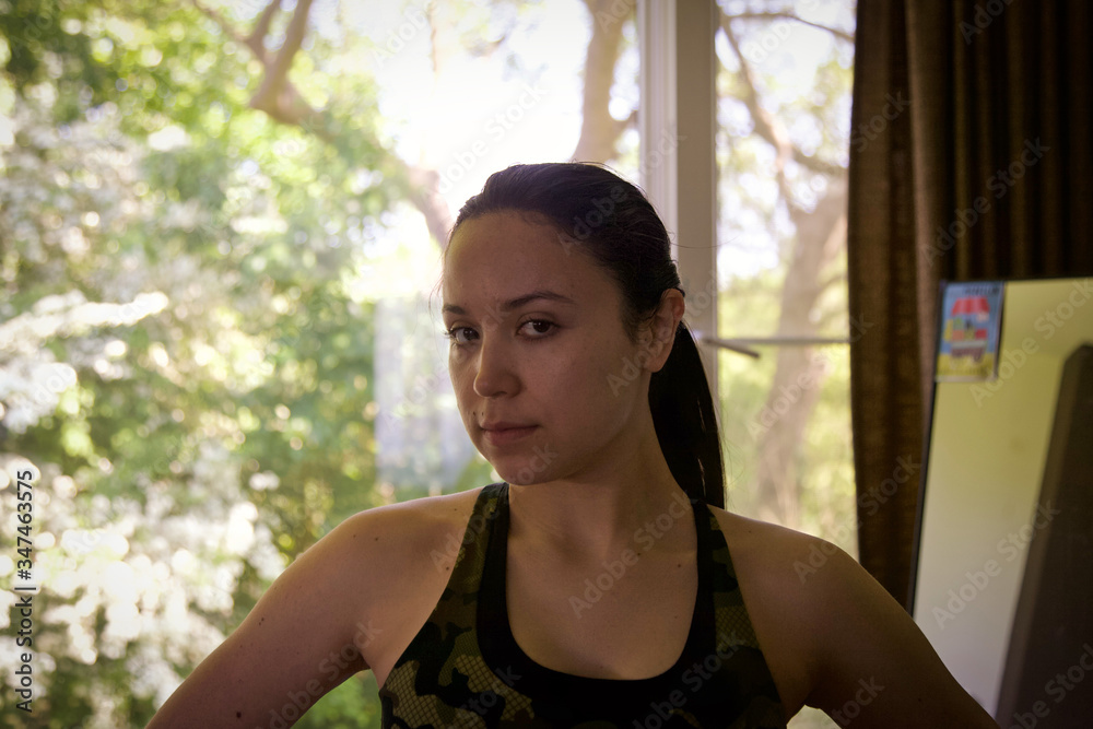 Strong latina woman ready for working out at home Strong latina woman ready for working out at home