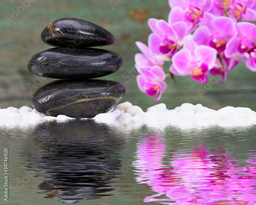 Japanese Zen garden with stacked stones mirroring in water