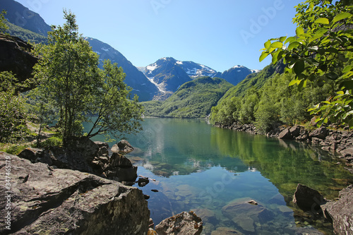 Bondhus Lake with beautiful scenery   reflections in the water. The lake is reached along the mountain hike  near Rosendal  Folgefonna National Park  Norway.