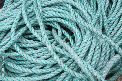 Close up of green blue turquiose rope used for fishing or sailing, Norway.