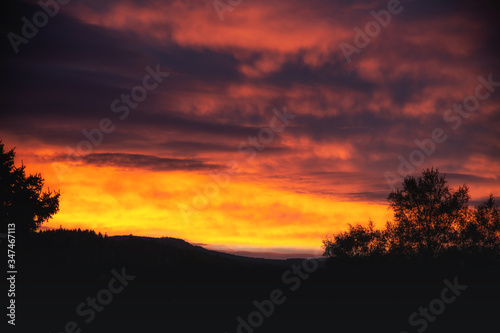 Beautiful romantic sunset in the mountains  black silhouette