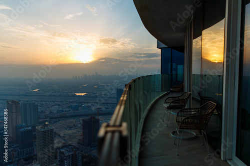 Photography Sunset top view city with modern hotel balcony