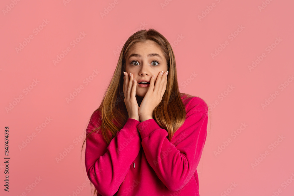 Scared girl covers her face with hands Scared girl covers her face with hands