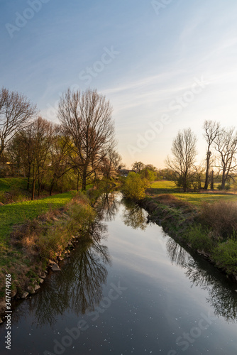 Odra river with meadow and trees around near Ostrava city in Czech republic