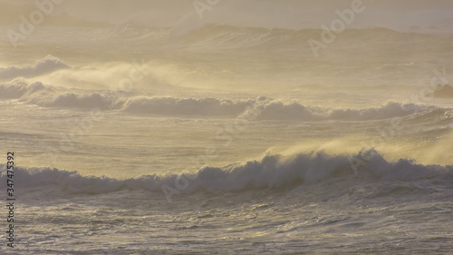 Detail of waves in rough sea at sunset. Galicia Spain.