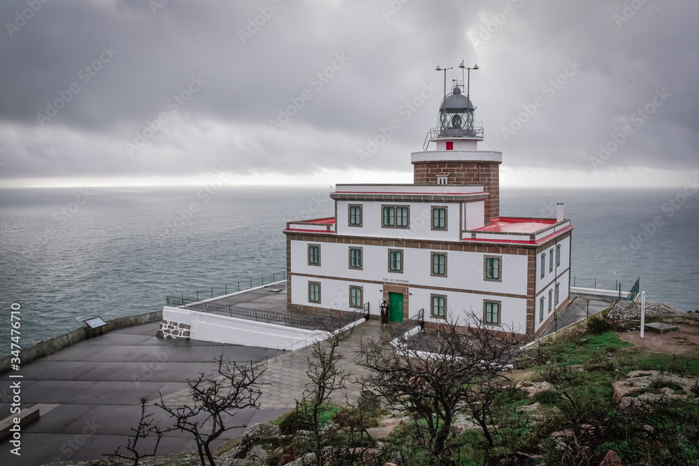 View from above Finisterre Lighthouse, on the route of the Camino de Santiago. On a cloudy day, with the sea in the background. Galicia, Spain