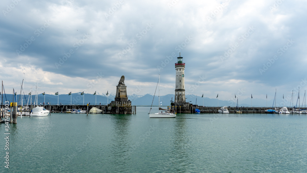 Sailboat entering the harbour of Lindau, Germany