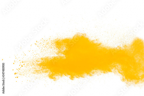 Orange powder dust particles explosion on white  background.Orange dust particles splash.