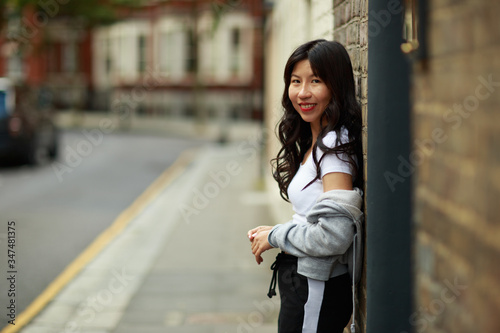 portrait of a young chinese lady in the street
