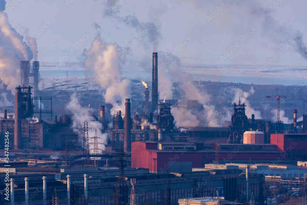 Plant view. Plant with pipes and smoke. Panorama of  industrial complex. Emissions of air pollutants. smoke from the chimney