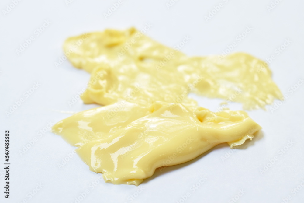 cheese melting down by heat temperature on white background