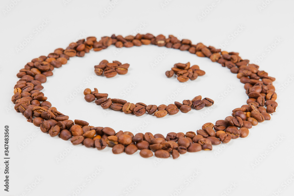roasted coffee beans on a white background roasted coffee beans on a white background