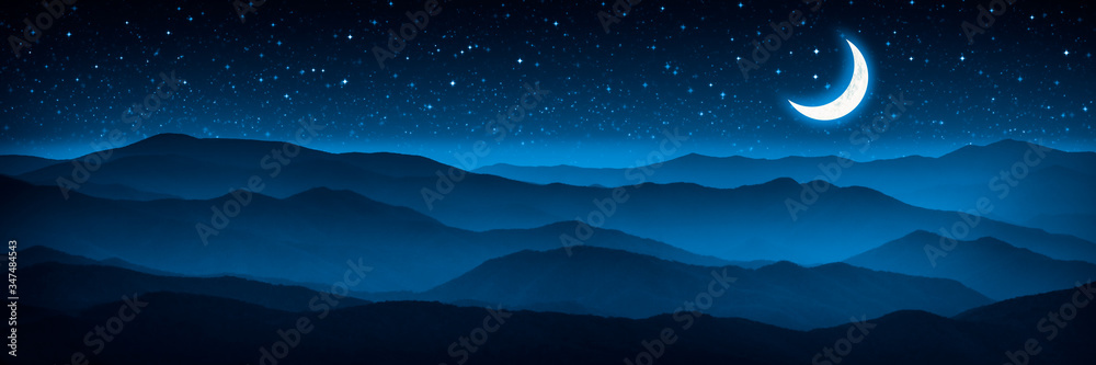 Glowing Crescent Moon And Starry Sky Over Foggy Mountain Range