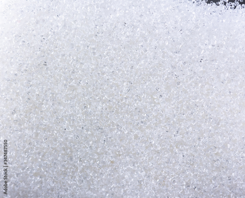 Close up of crystal sugar in Glass bottles on white background.