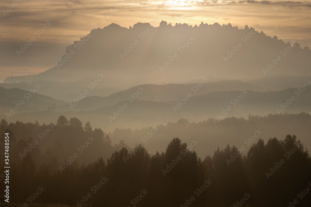 Fototapeta premium Layers and mist below Montserrat mountain
