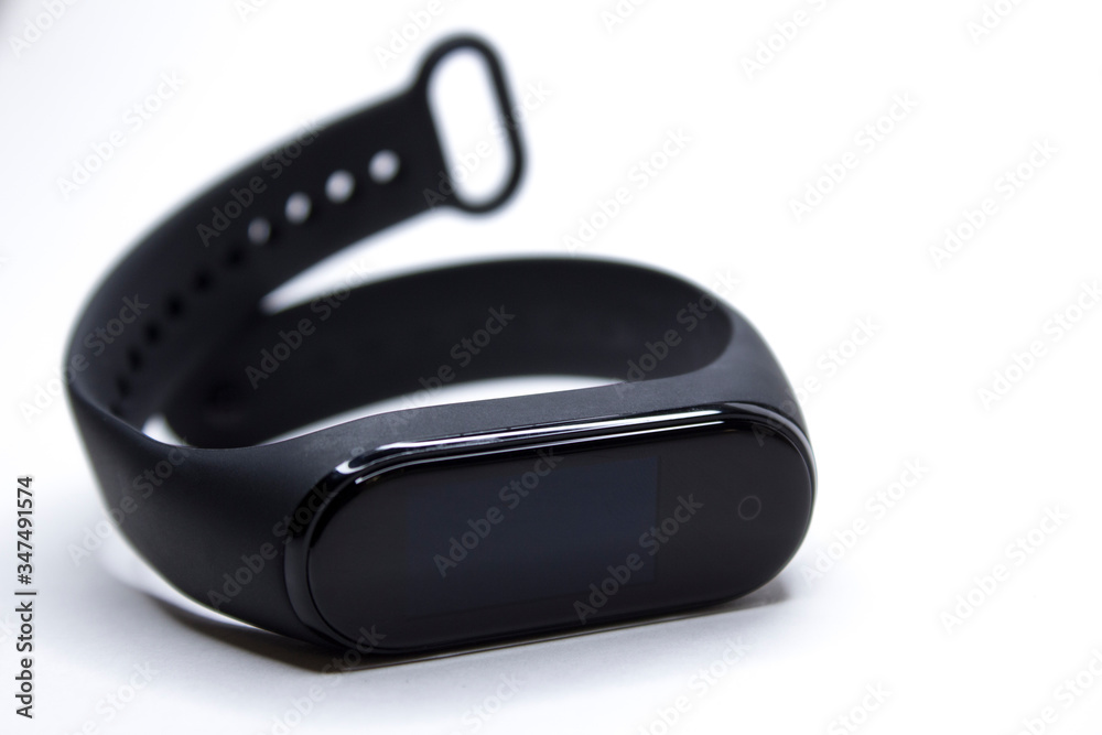 Fitness wrist bracelet. Modern technologies for monitoring health. Electronic watch with interchangeable bracelet. Icholated on a white background. Fitness wrist bracelet. Modern technologies for monitoring health. Electronic watch with interchangeable bracelet. Icholated on a white background.