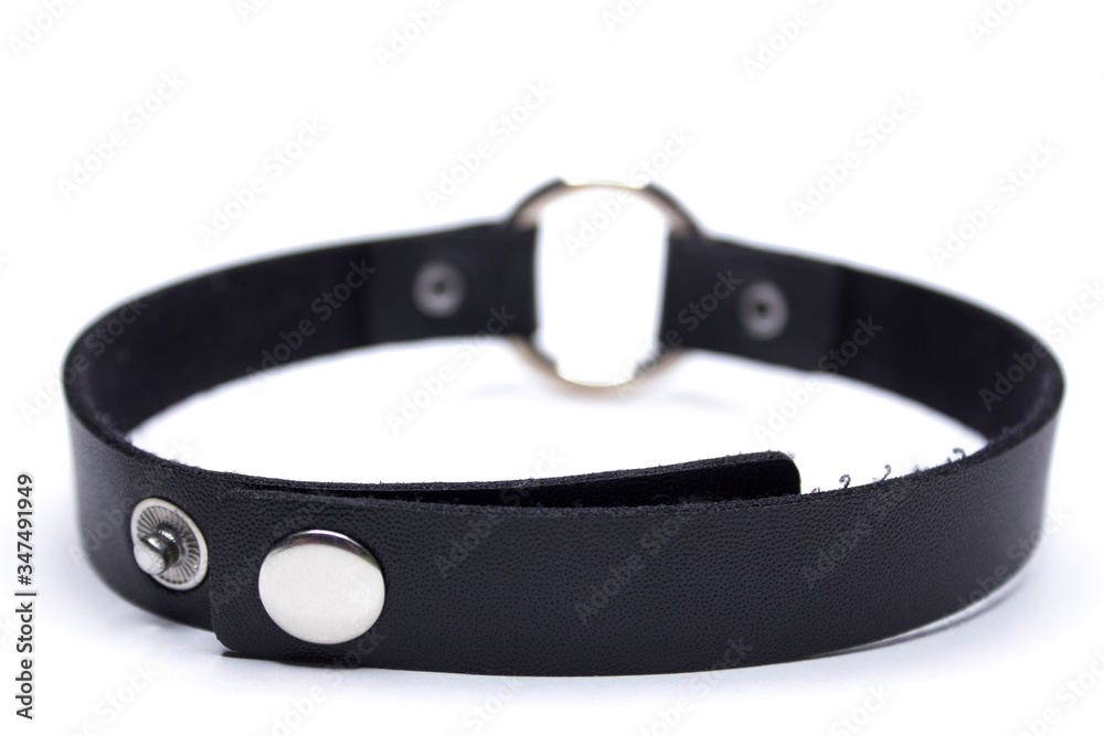 Leather choker with a circle. Decoration on the neck. Isolated on a white background. Leather choker with a circle. Decoration on the neck. Isolated on a white background.