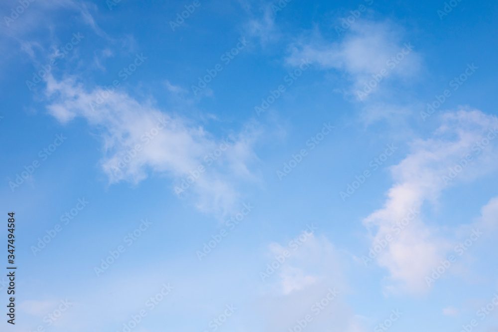 Beautiful white Cirrus clouds in a blue sky. Background and texture of the sky Beautiful white Cirrus clouds in a blue sky. Background and texture of the sky