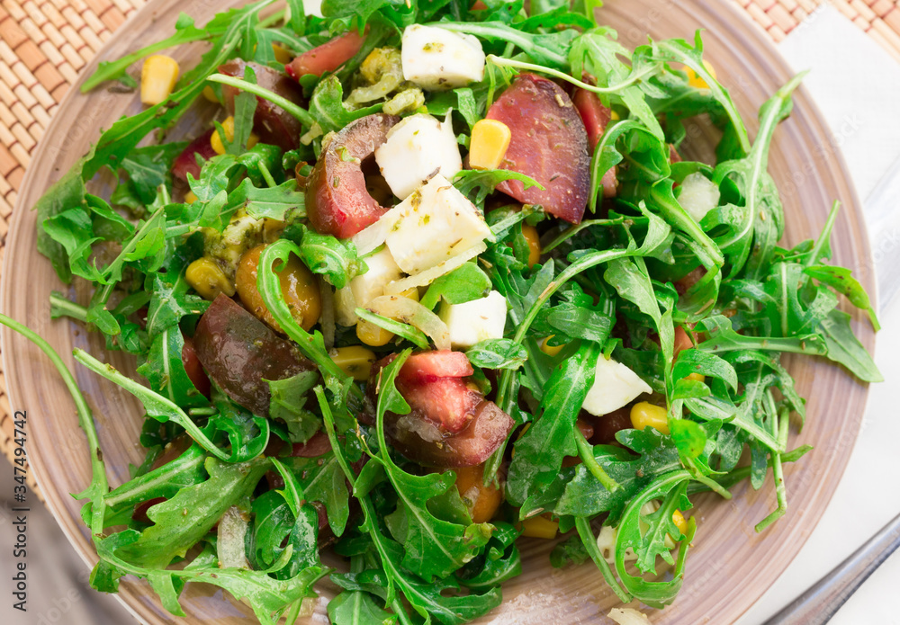 mixed salad of arugula and fresh vegetables with sauce mixed salad of arugula and fresh vegetables with sauce