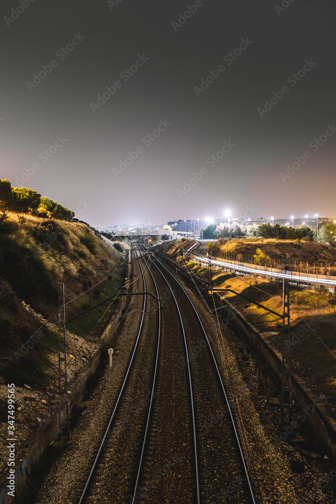 Train tracks at night in the city