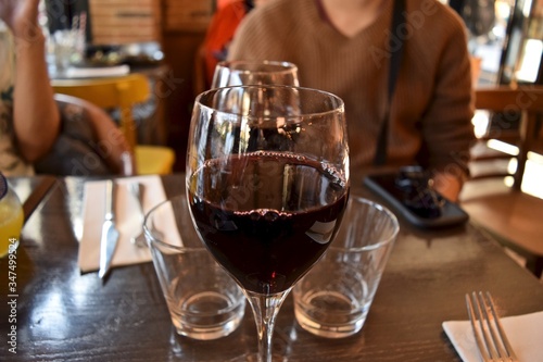A glass of red wine on table in France.