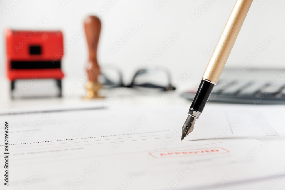 Close up of fountain pen on document. Law concept Close up of fountain pen on document. Law concept