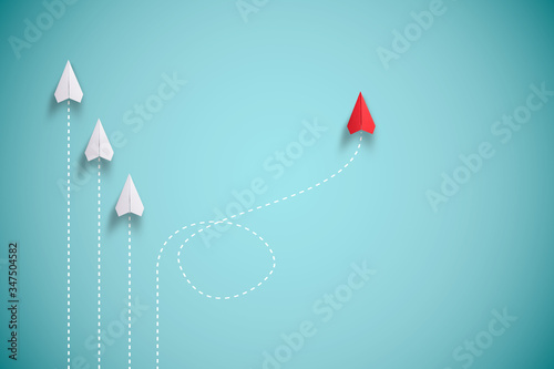 Red paper plane out of line with white paper to change disrupt and finding new normal way on blue background. Lift and business creativity new idea to discovery innovation technology.