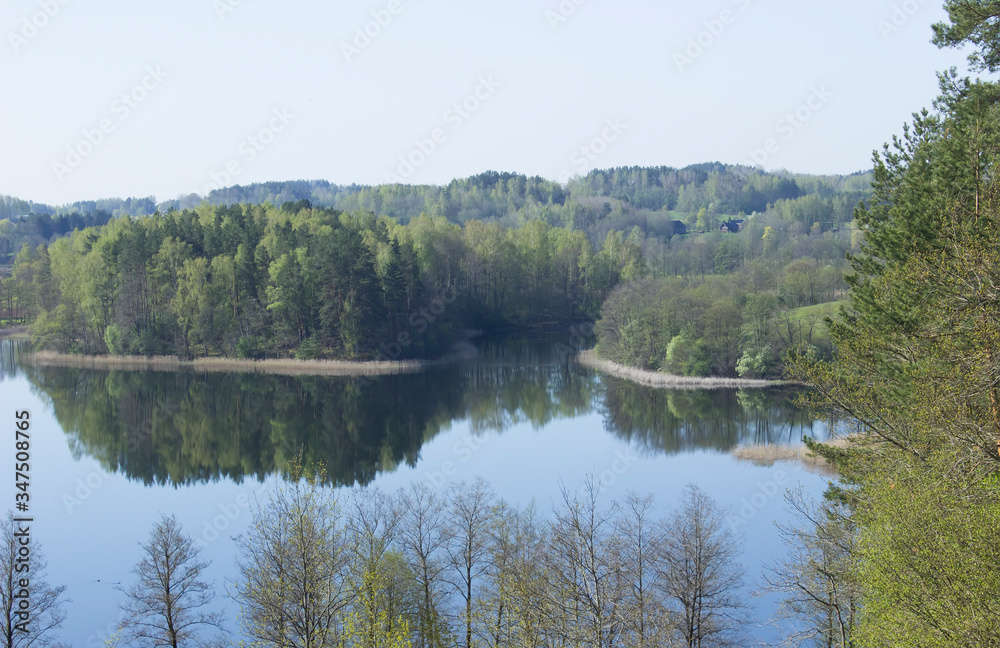 Very beautiful landscape from the hill Ladakalnis. View of the lake with reflection in the water Very beautiful landscape from the hill Ladakalnis. View of the lake with reflection in the water