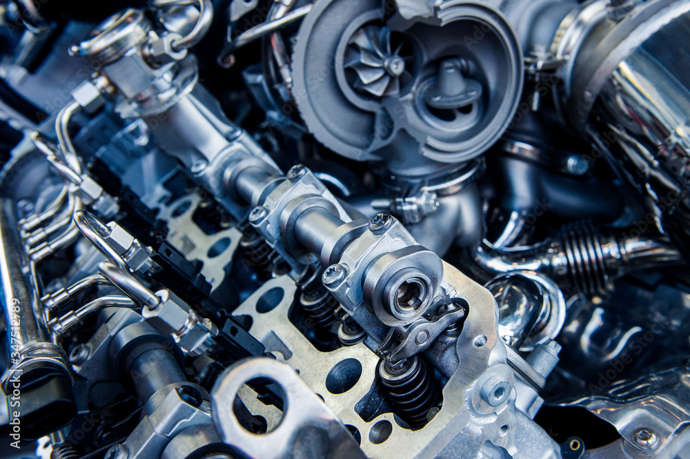 Car engine, concept of modern vehicle motor with metal. Closeup photo of a clean motor block Car engine, concept of modern vehicle motor with metal. Closeup photo of a clean motor block