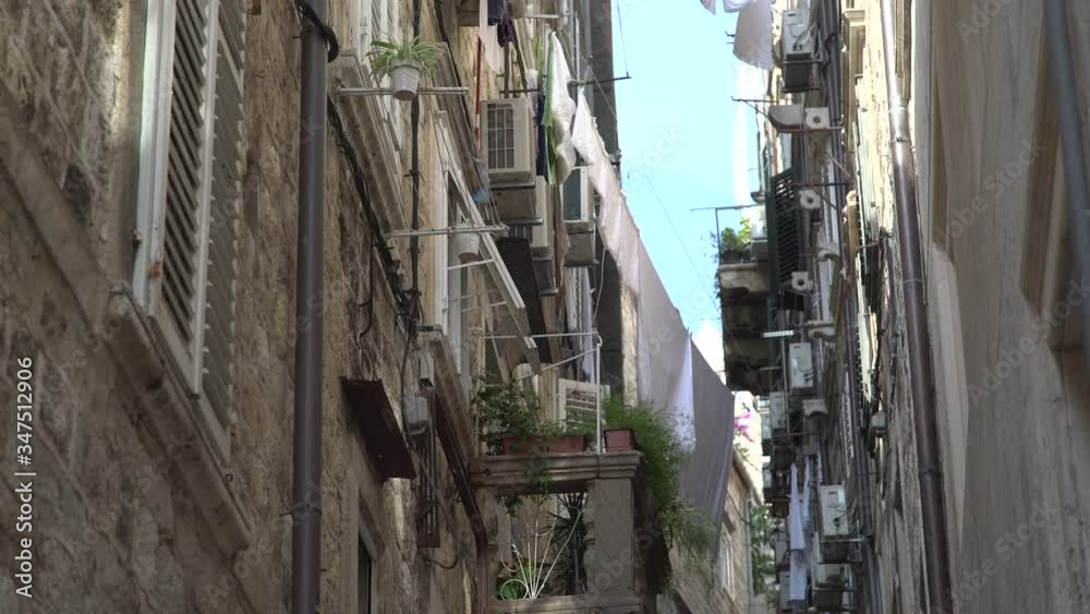 Narrow street in the old town of Dubrovnik Narrow street in the old town of Dubrovnik