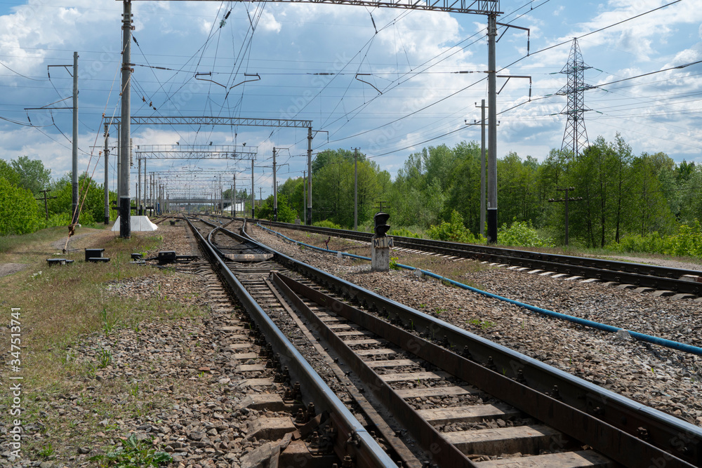 Railroad tracks for trains for the delivery of industrial goods and the transport of passengers