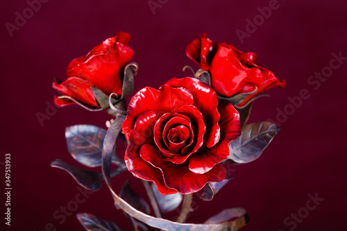  red roses made of metal as symbol of immortal love