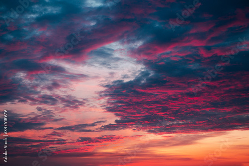 Pink sky with purple clouds during sunset © Prostock-studio