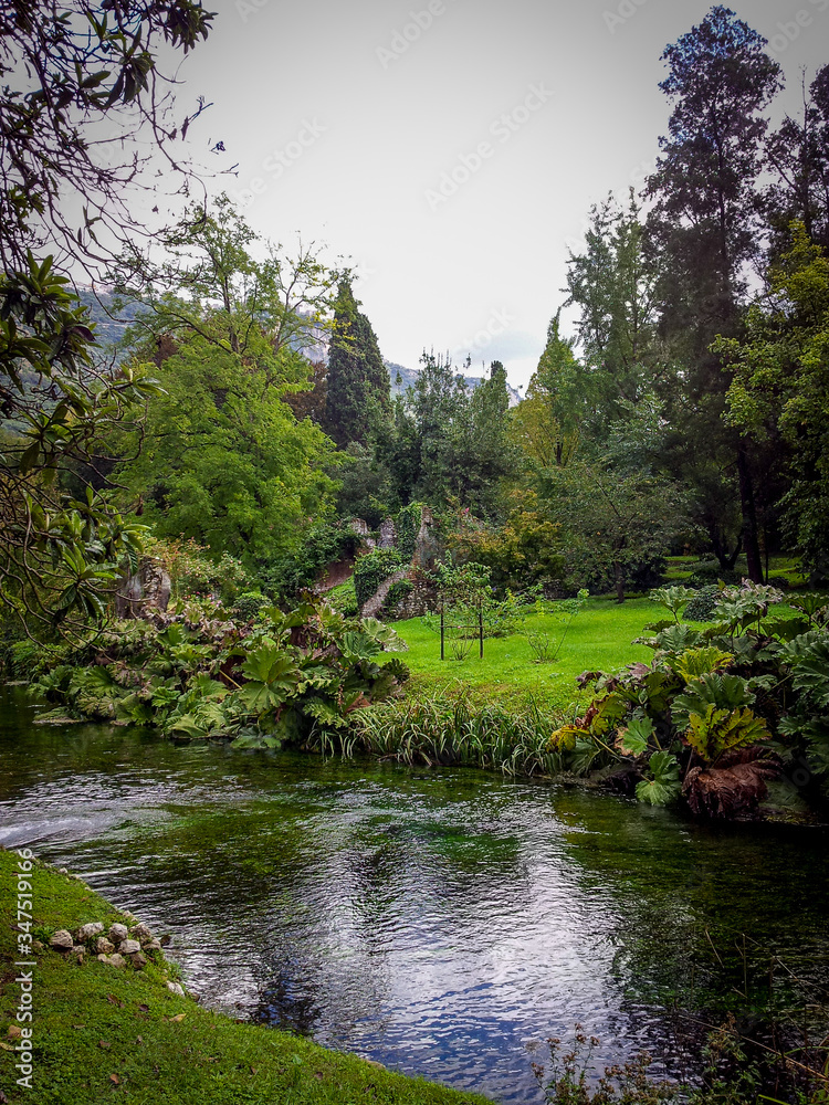 Ruins and reflection in Giardini di Ninfa, in Italy Ruins and reflection in Giardini di Ninfa, in Italy