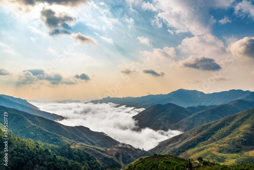 Ta Xua is a famous mountain range in northern Vietnam. All year round, the mountain rises above the clouds creating cloud inversions. photo