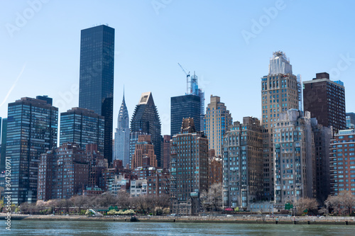 Skyline of Midtown Manhattan during Spring along the East River in New York City